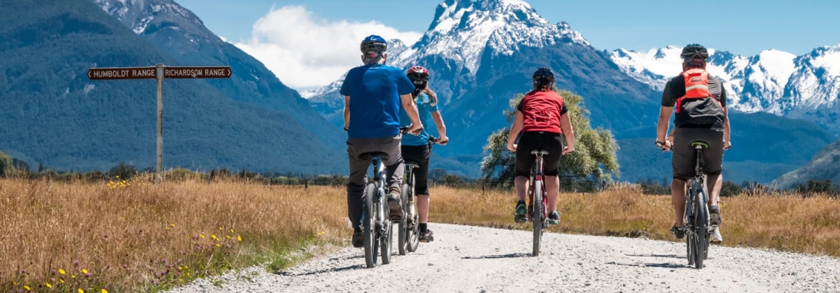 Glenorchy trails riders with snowcapped mountains
